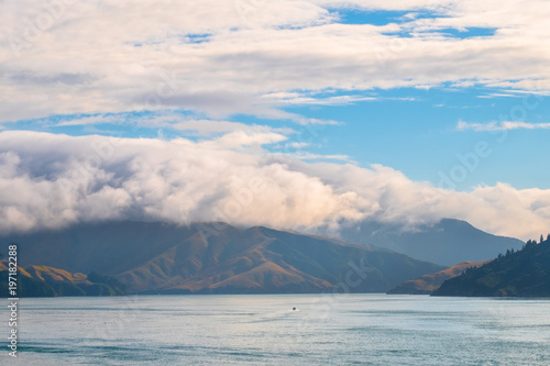 Landscape of the Mountain and sea with cloudy in the morning. View from the ferry to South Island, New Zealand.