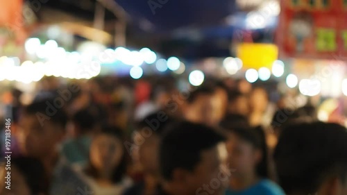 Wallpaper Mural Blurred busy many people walking on narrow alley of dark night Thai local market, with moving white light round bokeh, top perspective view Torontodigital.ca