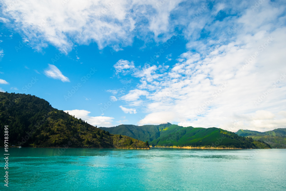 Landscape of the Mountain and sea with cloudy in the morning. View from the ferry to  South Island, New Zealand.