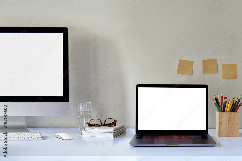 Fototapeta premium workspace with computer blank white screen.
