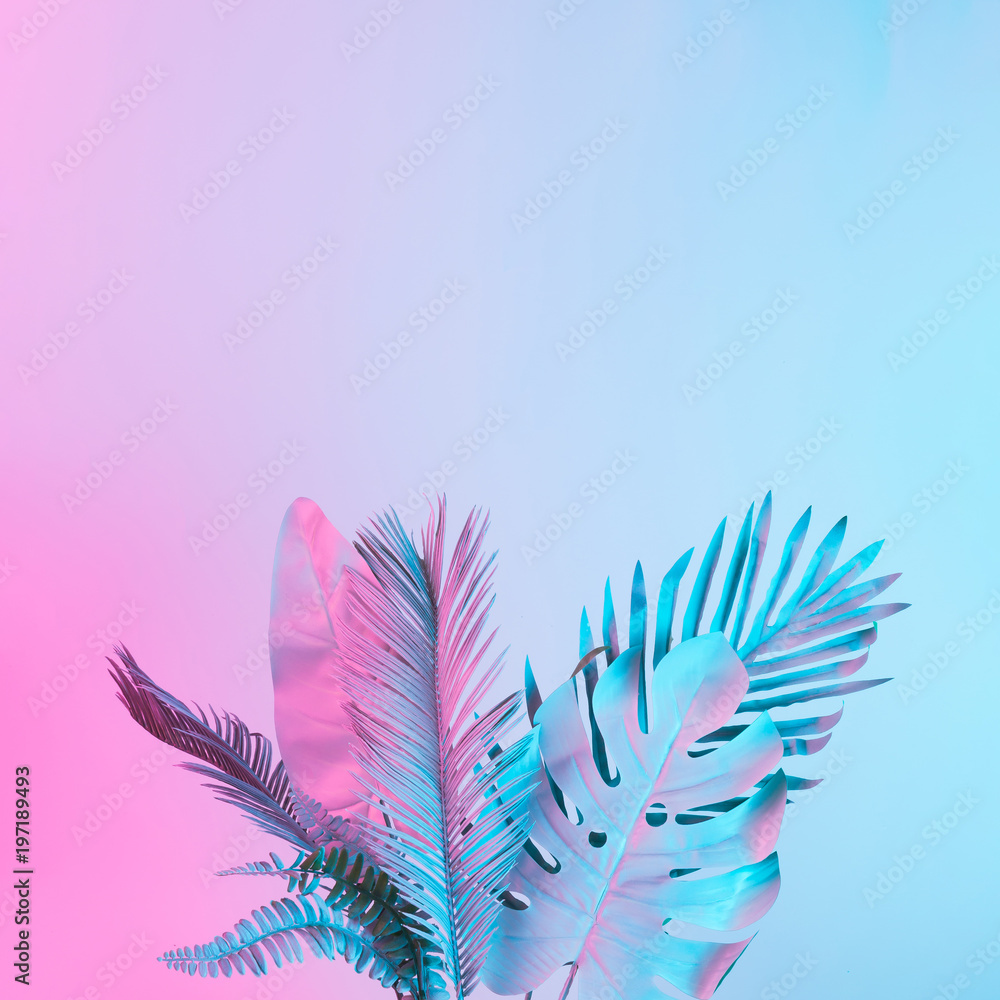 Fototapeta premium Tropical and palm leaves in vibrant bold gradient holographic colors. Concept art. Minimal surrealism.