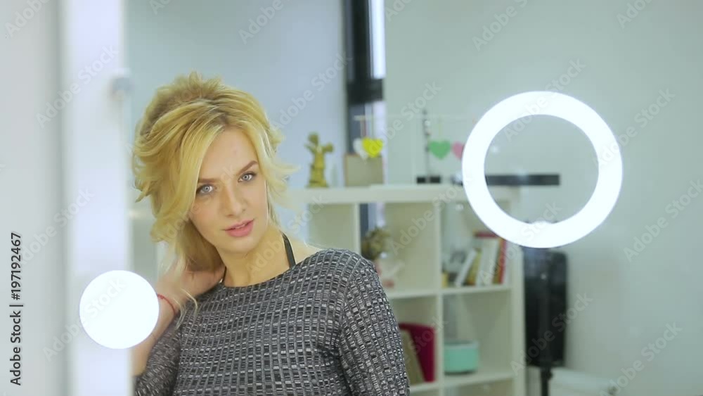 cute blonde looks in the mirror with lanterns. close up cute blonde looks in the mirror with lanterns. close up