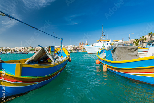 Beautiful colorful fishing boats in Marsaxlokk harbour Malta