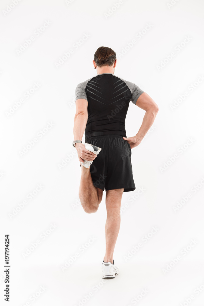 Fototapeta premium Back view full length portrait of a fit mature sportsman