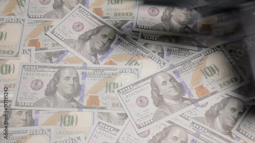 Wallpaper Mural A hand picking (and leaving) a gun and a bullet from a table full of US Dollar banknotes.
 Torontodigital.ca