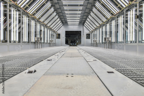 Paint booth repair station. High-quality painting of production line process in vehicles factory.