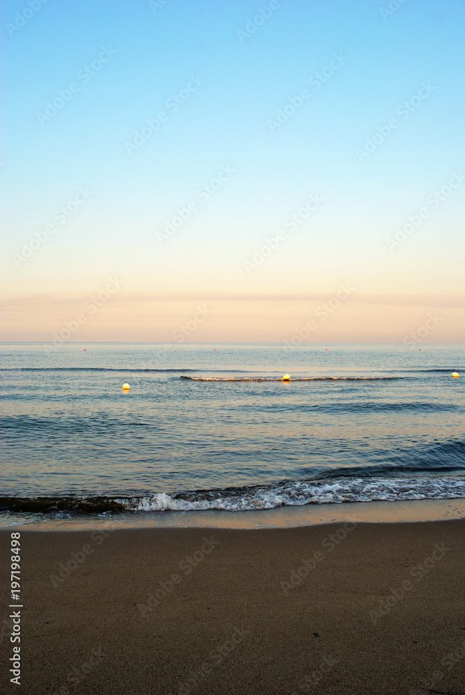 summer sea, early morning on the beach, romantic pink sunrise, vertical summer sea, early morning on the beach, romantic pink sunrise, vertical