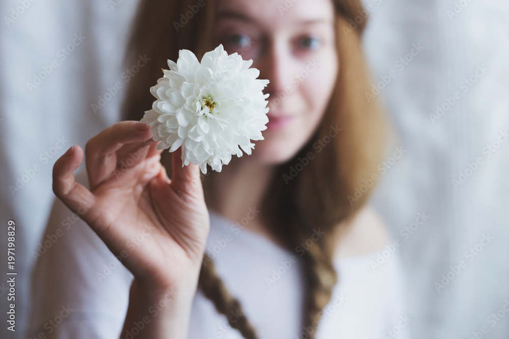 Beautiful ginger woman with white chrysanthemum Beautiful ginger woman with white chrysanthemum