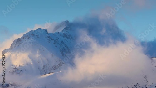 Winter timelapse between sunset and twilight of Bure Peak (Pic de Bure) in the Devoluy Massif. Hautes-Alpes, French Alps, France photo