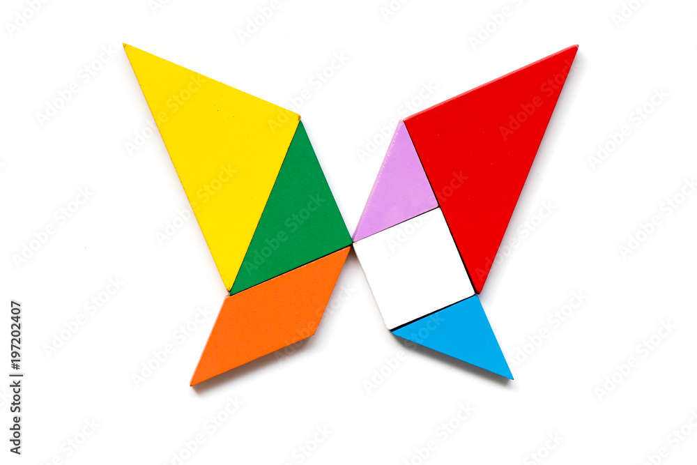 Color wood tangram puzzle in butterfly shape on white background Color wood tangram puzzle in butterfly shape on white background