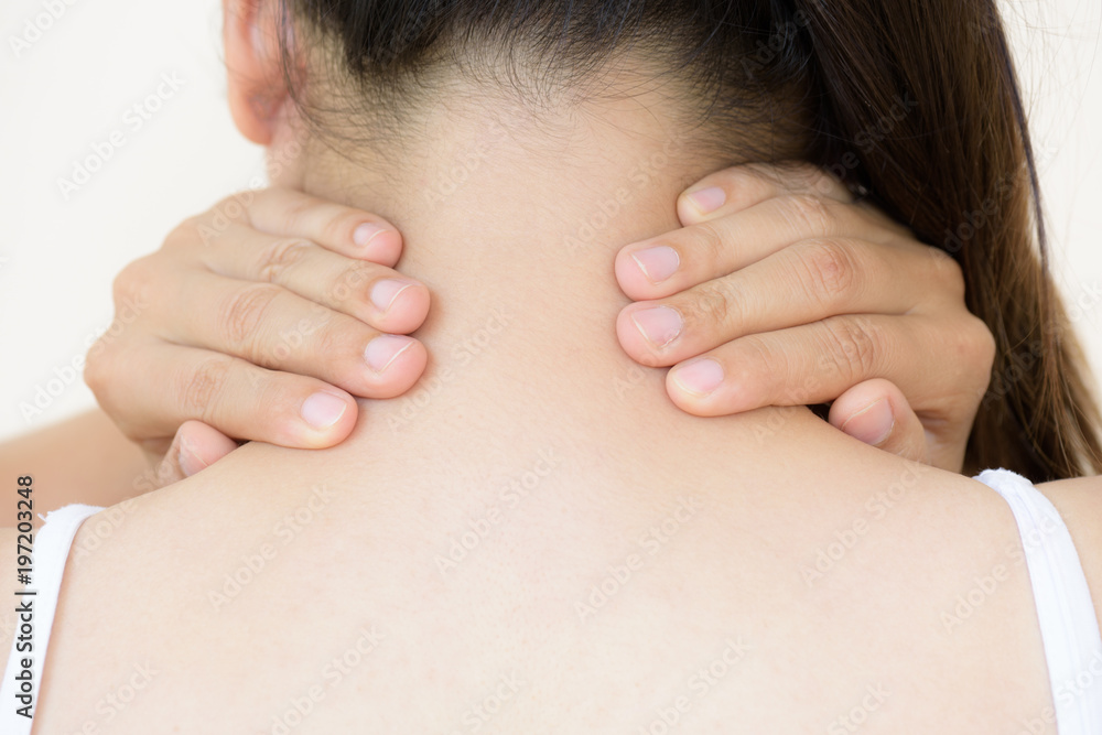 Closeup woman neck and shoulder pain and injury. Health care and medical concept. Closeup woman neck and shoulder pain and injury. Health care and medical concept.
