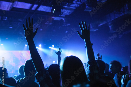 hands of fans raised up, during a concert, show or performance