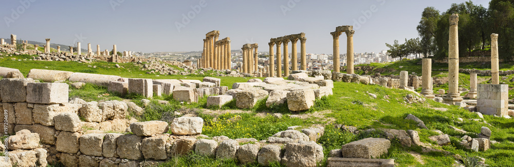 panorama of ruins with columns in old city in spring day in Jordan