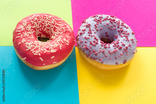 donuts on a beautiful colored background, pastel glamor colors