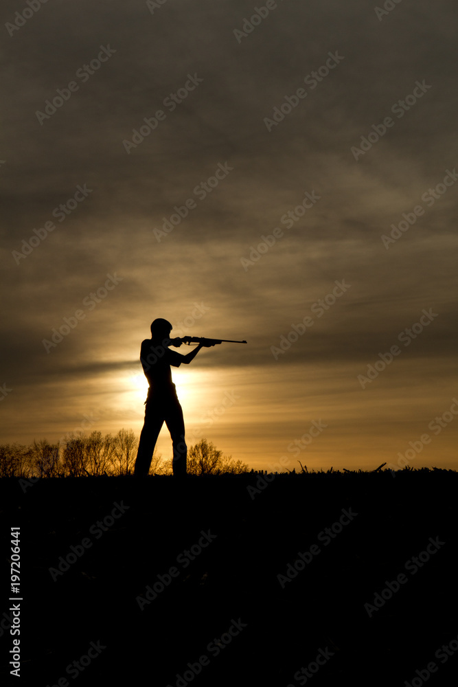 small game hunter in the sunset small game hunter in the sunset