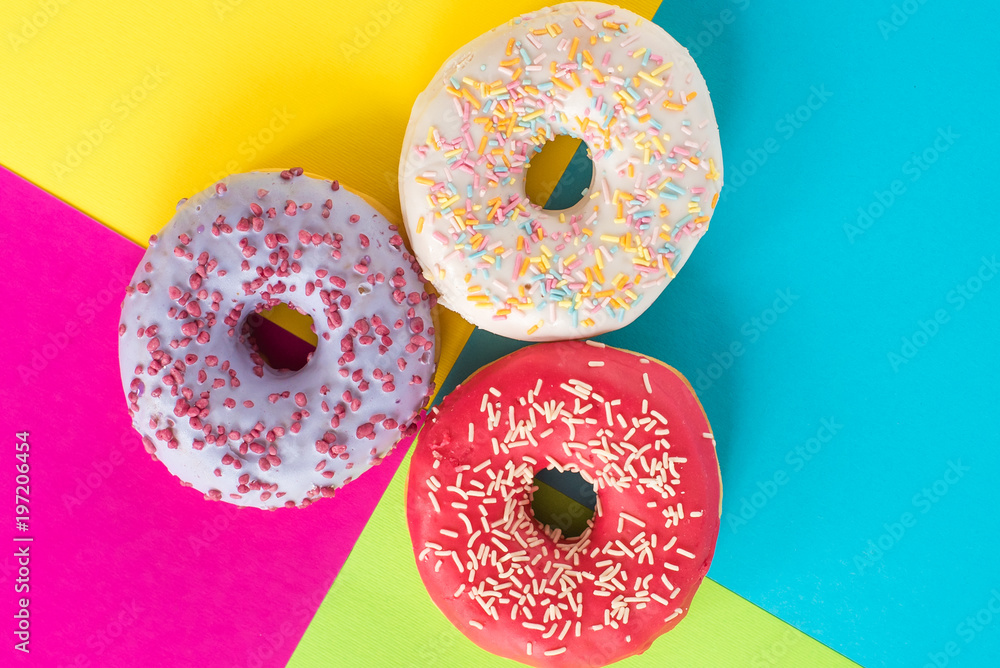 donuts on a beautiful colored background, pastel glamor colors