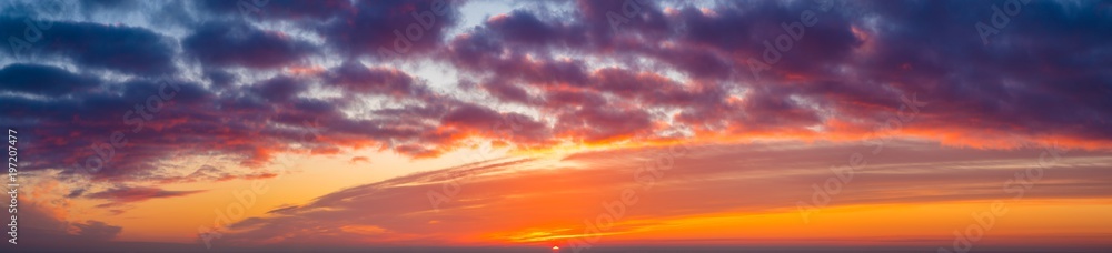 Fiery sunset, colorful clouds in the sky,panorama