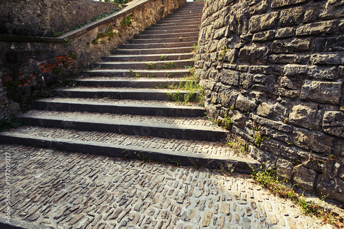 Bergamo, Italy. Stone staircase ancient pedestrian with a turn. photo