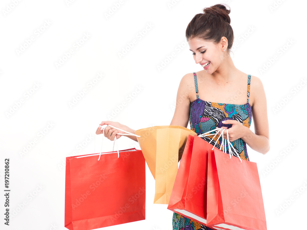 Portrait of young happy smiling woman with shopping bags.Young happy summer shopping woman with shopping bags on white background Portrait of young happy smiling woman with shopping bags.Young happy summer shopping woman with shopping bags on white background