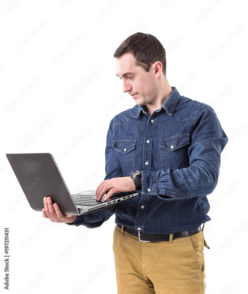 young programmer holding a laptop in hands isolated on white background. Copy space young programmer holding a laptop in hands isolated on white background. Copy space