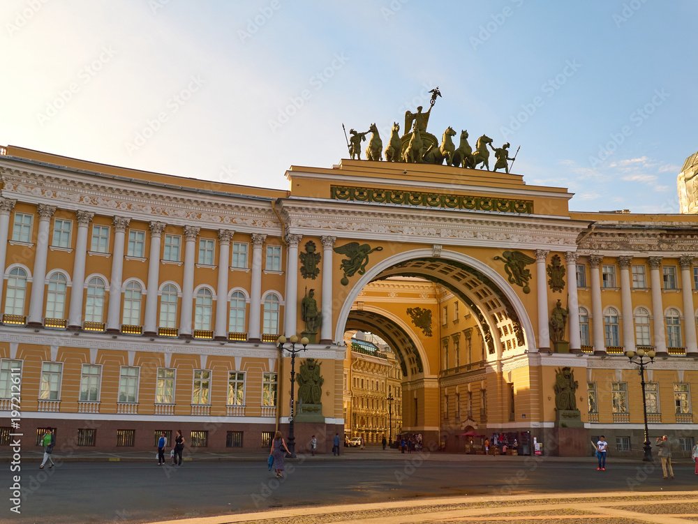 People next to the Arch of the General Staff in Saint Petersburg, Russia
