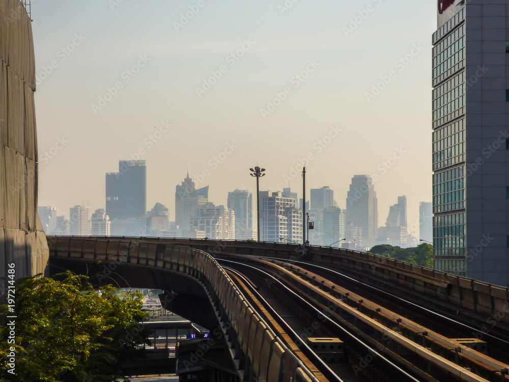 Naklejka premium Sky train tracks and skyscrapers in Bangkok, Thailand