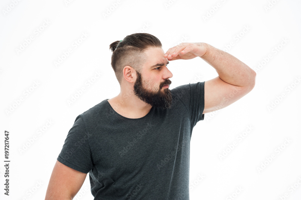 Portrait of a concentrated bearded man in plaid shirt carrying backpack and looking far away isolated over white background Portrait of a concentrated bearded man in plaid shirt carrying backpack and looking far away isolated over white background