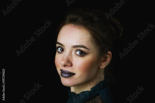 Beautiful young woman on dark background . Fashion and makeup