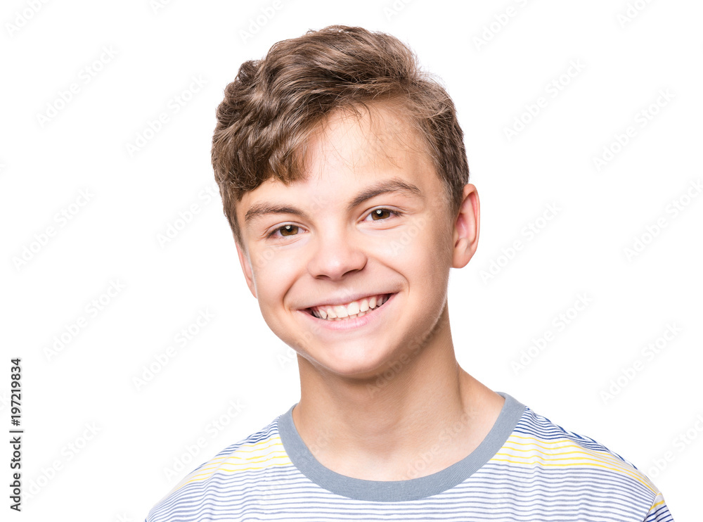 Portrait of smiling teen boy. Teenager wearing t-shirt looking at camera. Happy cute child isolated on white background. Portrait of smiling teen boy. Teenager wearing t-shirt looking at camera. Happy cute child isolated on white background.