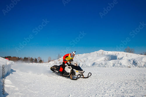 Snowmobile. Snowmobile races in snow. Concept winter sports, racers.