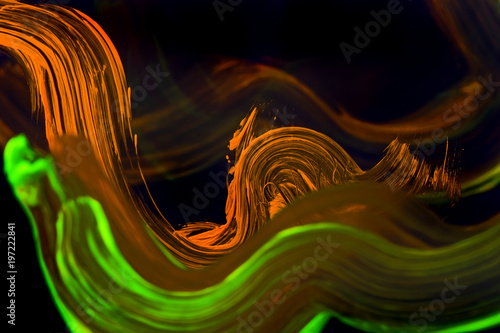 Abstract paint brush on the clear glass with light from neon.