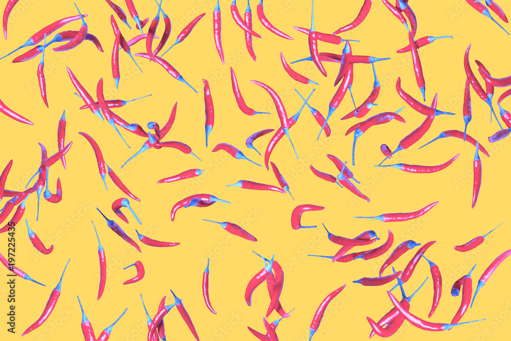 Conceptual collage. A lot of pink pepper on a yellow background Conceptual collage. A lot of pink pepper on a yellow background