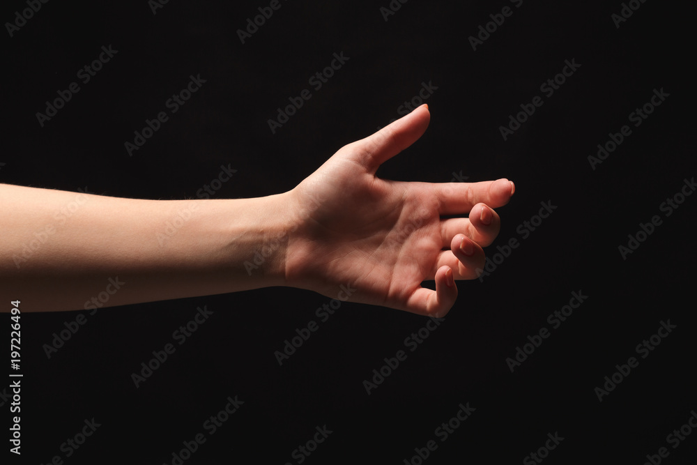Outstretched female hand offering or asking for help Outstretched female hand offering or asking for help