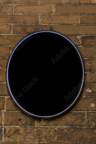 Empty oval sign on the old ...