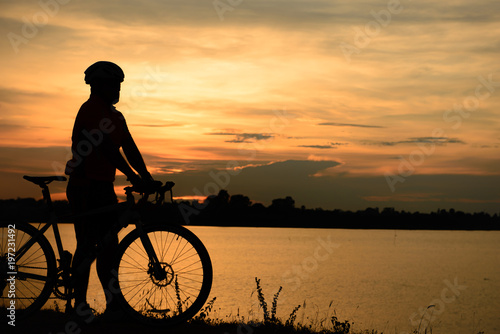 Silhouette of cyclists at sunset,Thailand people