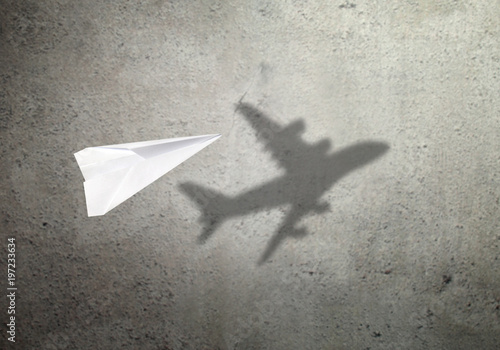 Paper plane shadow concept photo