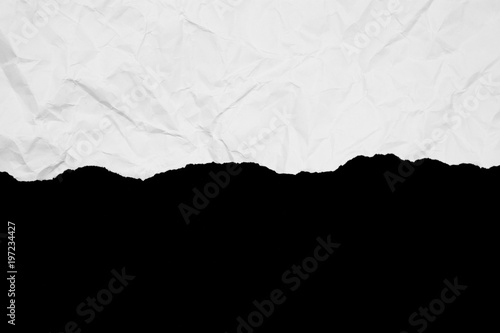 ripped of white paper isolated on black background