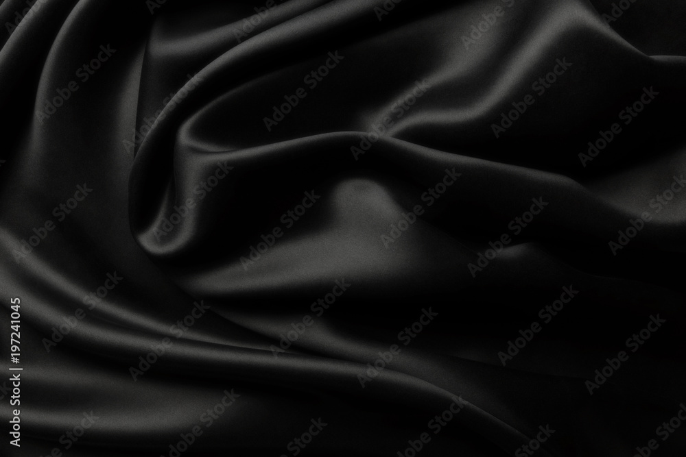 Elegant black satin silk with waves, texture background