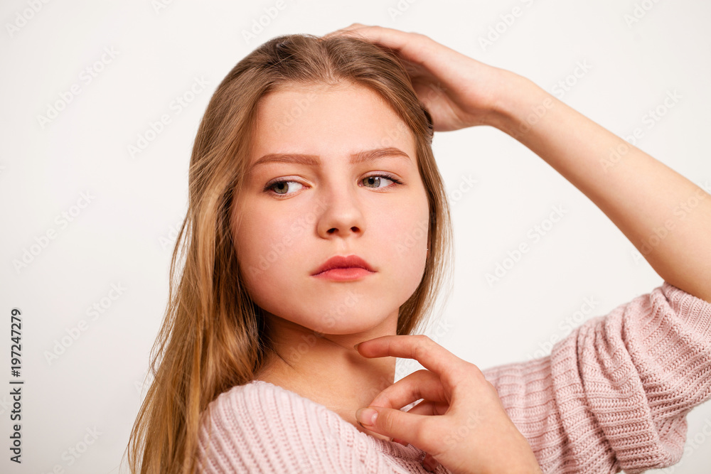 Close up portrait of a pretty young schoolgirl with dark blonde hair Close up portrait of a pretty young schoolgirl with dark blonde hair
