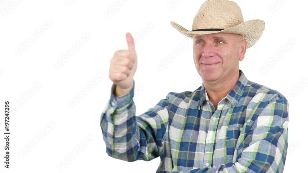 Farmer Smiling Pointing with Finger Indicating Someone and Make Thumbs Up Sign Farmer Smiling Pointing with Finger Indicating Someone and Make Thumbs Up Sign