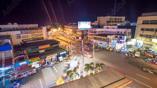 Night traffic on one of the central streets of the city of Legazpi. photo
