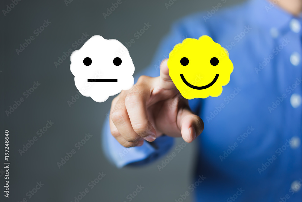 businessman hand pointing the smiley face icon, Rating for a Satisfaction Survey, Customer experience concept businessman hand pointing the smiley face icon, Rating for a Satisfaction Survey, Customer experience concept