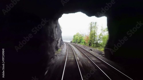 Train View.  The view from a train as it travels through New York State alongside the Hudson River before entering a tunnel (hd, 25fps).