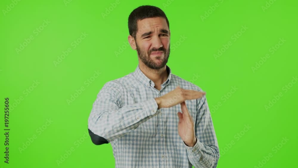 Young man doing a gesture of breaktime Young man doing a gesture of breaktime