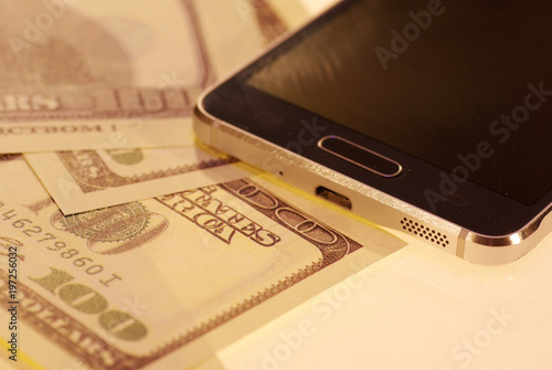 dollar bills and phone