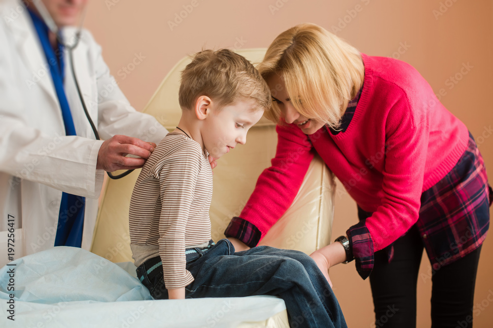 Fototapeta premium Pediatrician listen little boy with stethoscope