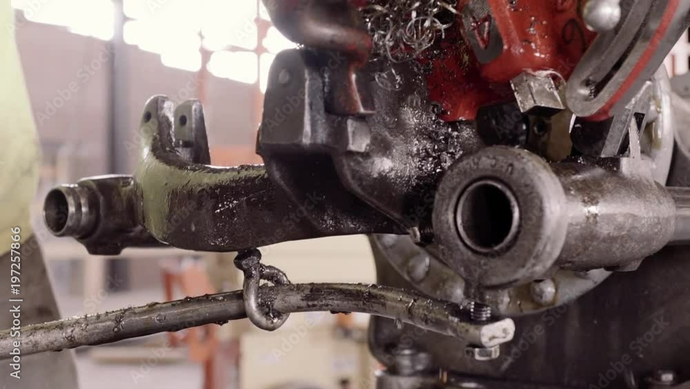 A Construction Worker Oils And Uses A Pipe Threading Machine A Construction Worker Oils And Uses A Pipe Threading Machine