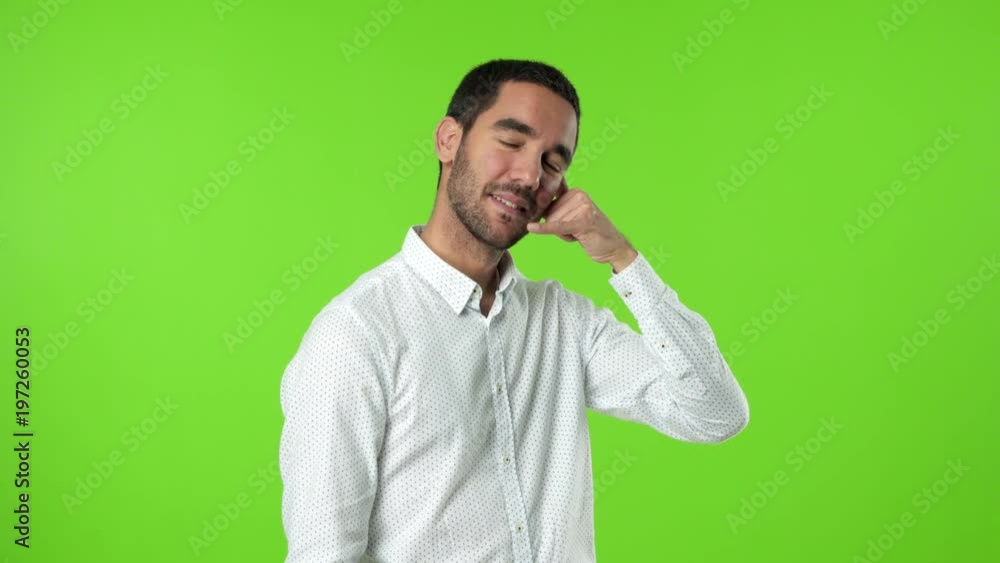 Happy young man with a gesture of call with his hand Happy young man with a gesture of call with his hand