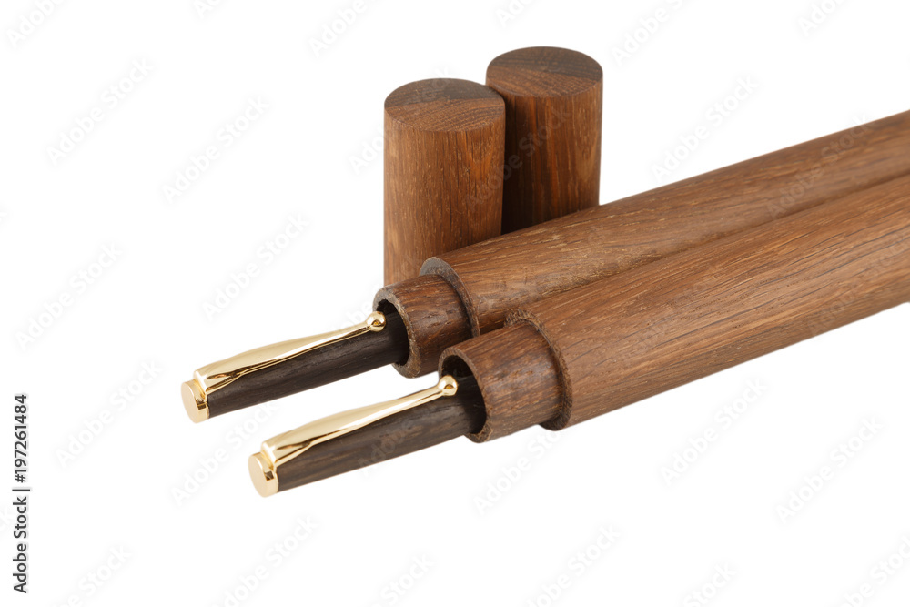 Wooden ball pen with a tube for storage on a white background