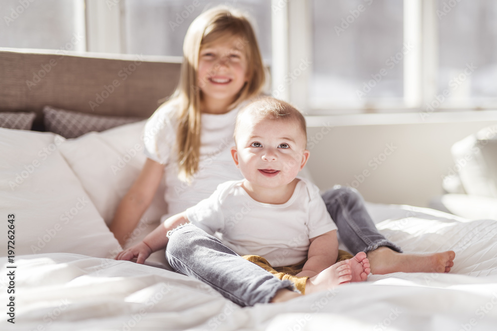 Little sister with her baby brother. Toddler kid Family with children at home. Little sister with her baby brother. Toddler kid Family with children at home.